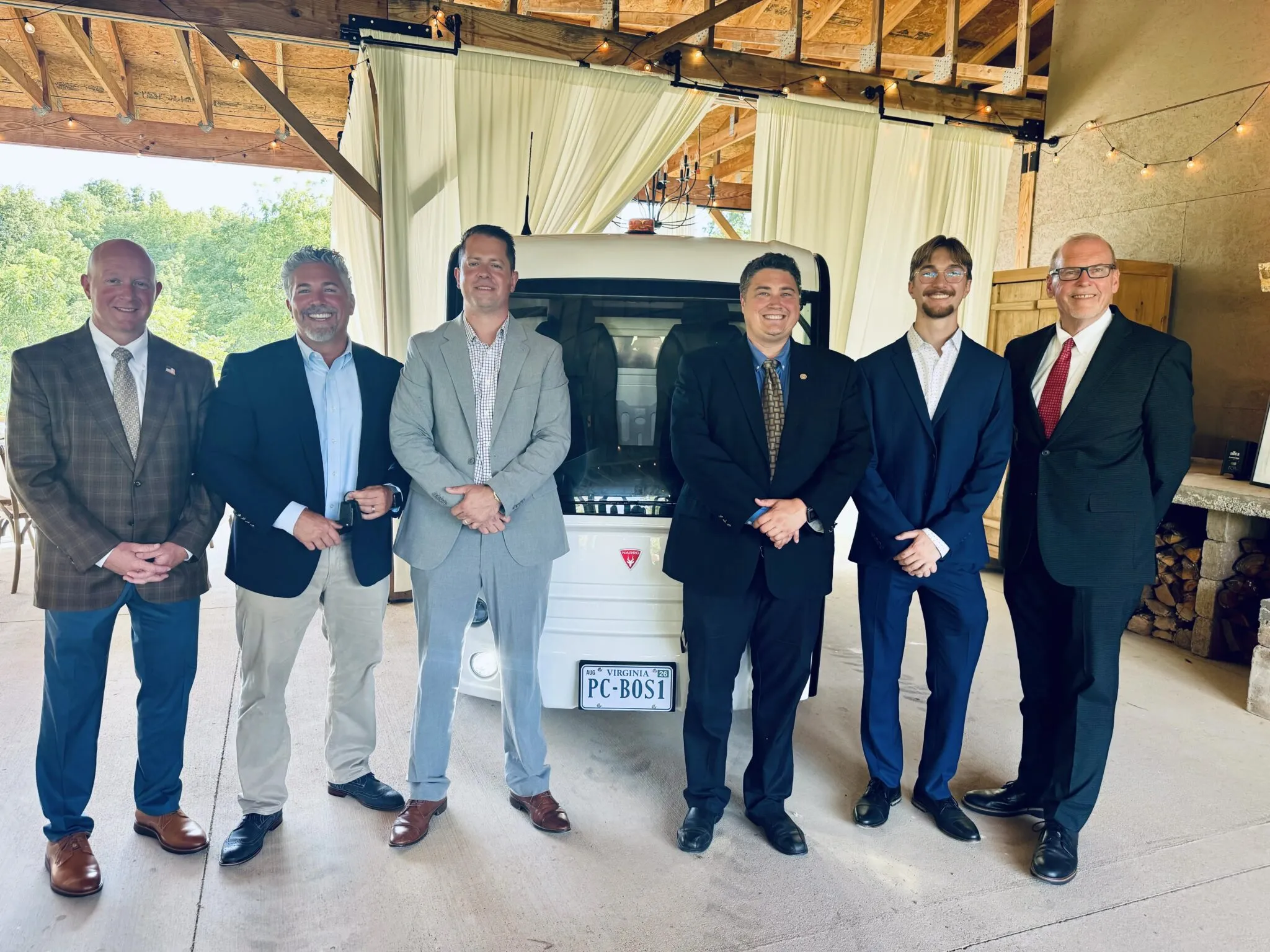 L to R: Delegate Jason Ballard, Pulaski County Administrator Jonathan Sweet, Narro CEO Maxell Collignon, VCC Executive Director Alleyn Harned, Narro CTO Cullen Danilowicz, and U.S. Congressman Morgan Griffith stand in front of the new Narro truck purchased by Pulaski County to use in the parks and recreation department.